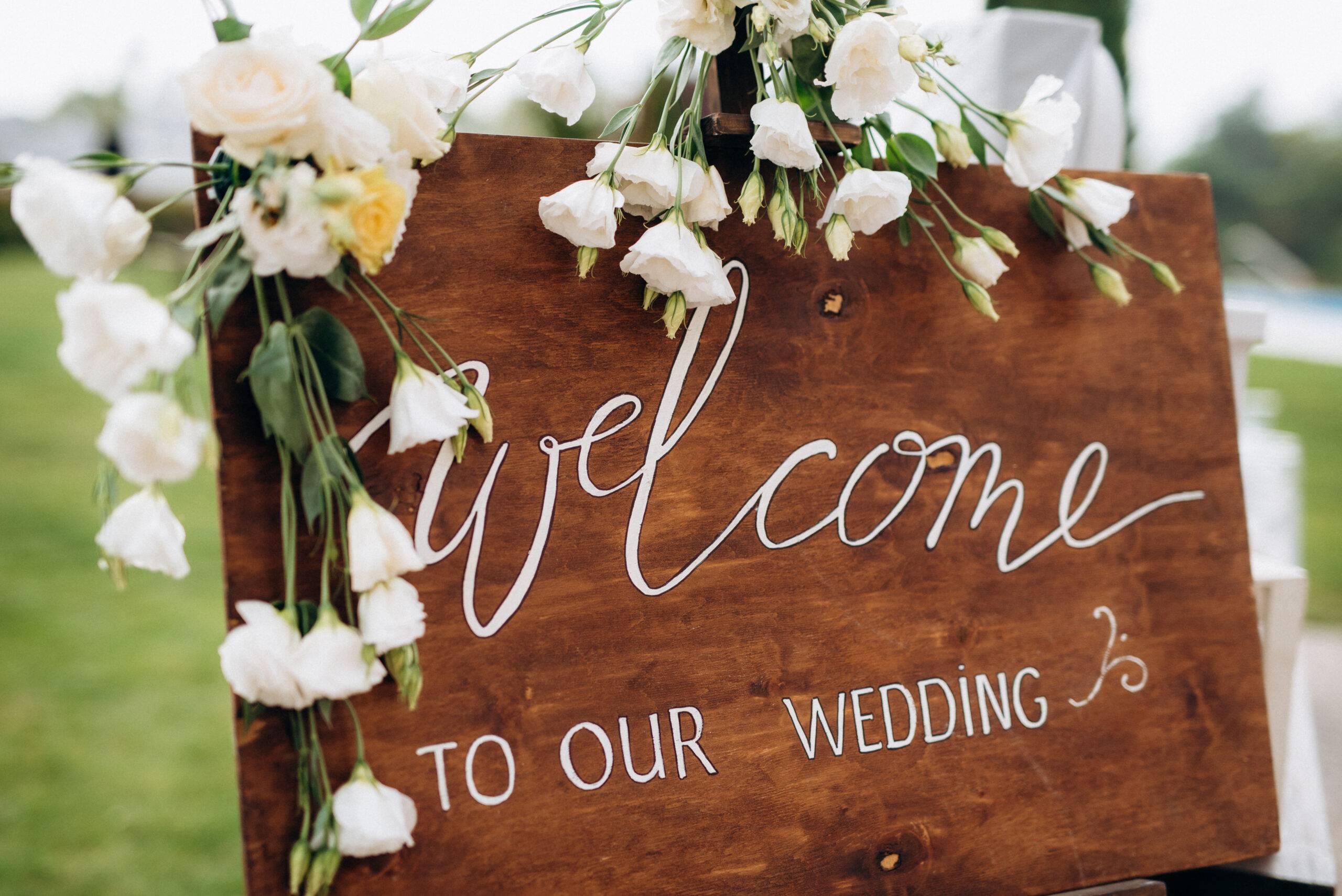 Large wooden welcome sign for a wedding